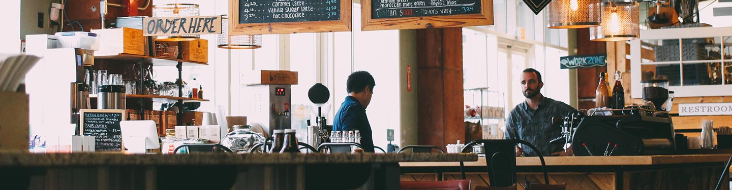 Two cafe owners havnig a business meeting